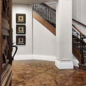Interior design of Deepdene Residence by Lewisham Interiors – grand staircase with ornate ironwork and detailed timber flooring