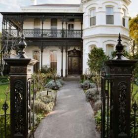 Hawthorn Residence by Lewisham Interiors – heritage Melbourne home with ornate wrought iron detailing and formal garden entry