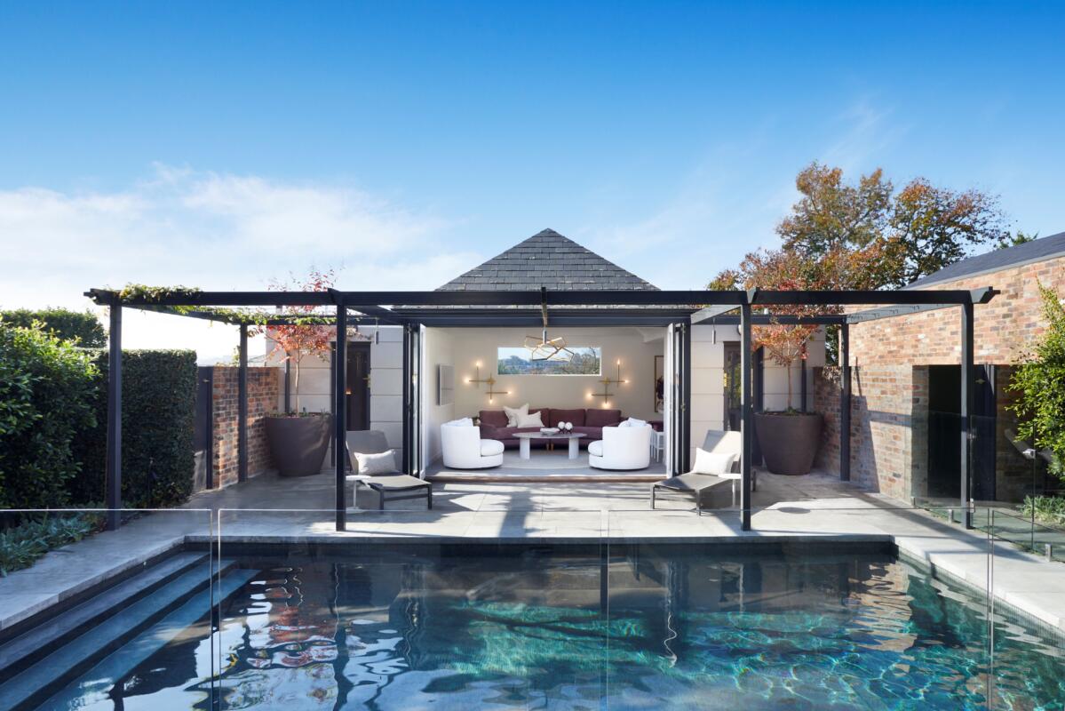 Lewisham Interiors Pool House – outdoor living design in Melbourne featuring lounge pavilion, custom seating, and landscaped pool area